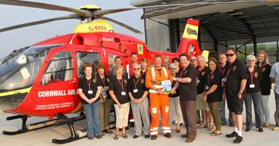 Towan Blystra Lions donate money for lifesaving Air Ambulance equipment